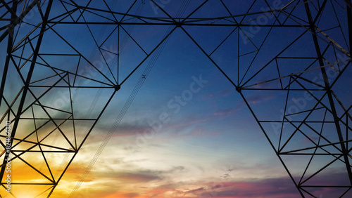 Close up bottom view electricity overhead power lines on sunset sky in Jakarta Indonesia.