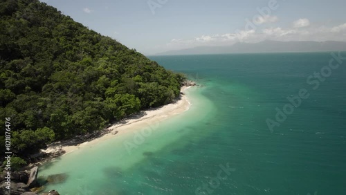 Aerial view of Nudey Beach with turquoise water, lush forest, and mountain, Fitzroy Island, Queensland, Australia. photo