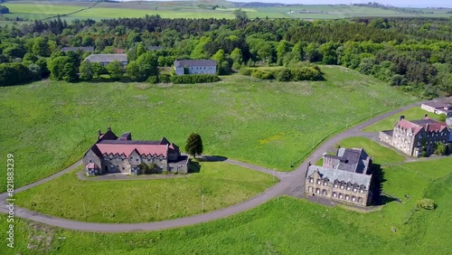 Aerial view of Bangour Village Hospital surrounded by greenery and trees, Broxburn, Scotland. photo