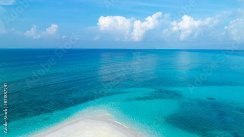 The soft wave water of the sea on the sandbar beach background photo