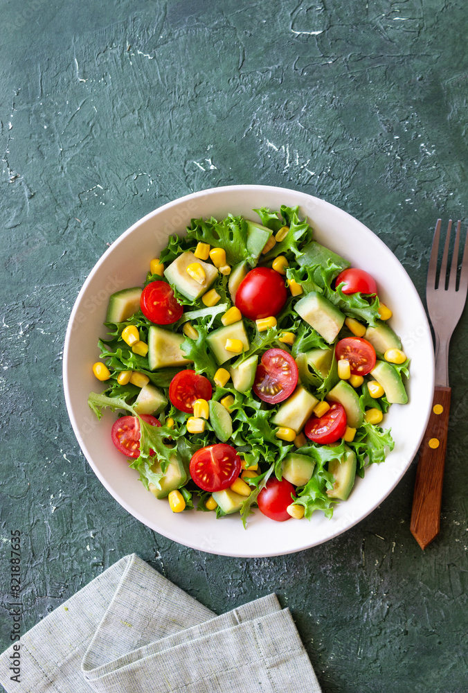 Salad with avocado, tomatoes and corn. Healthy eating. Vegetarian food. Salad with avocado, tomatoes and corn. Healthy eating. Vegetarian food.