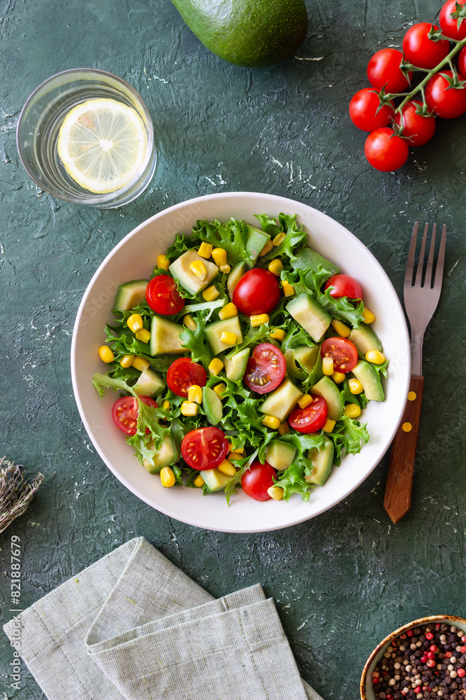 Salad with avocado, tomatoes and corn. Healthy eating. Vegetarian food. Salad with avocado, tomatoes and corn. Healthy eating. Vegetarian food.