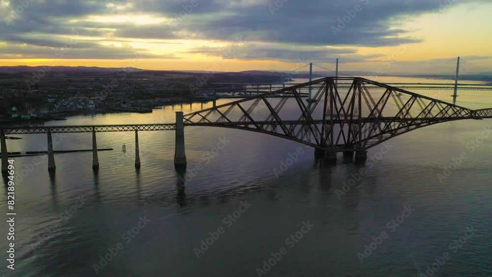 Aerial view of Forth Rail Bridge at sunset over river, Edinburgh, Scotland. Aerial view of Forth Rail Bridge at sunset over river, Edinburgh, Scotland.