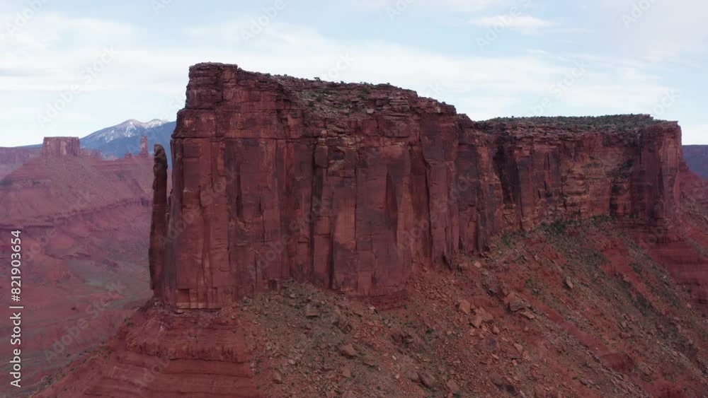 Drone flies around the tower mountain of Butte, Utah, United states and captures red stone land and beautiful tower. Drone flies around the tower mountain of Butte, Utah, United states and captures red stone land and beautiful tower.