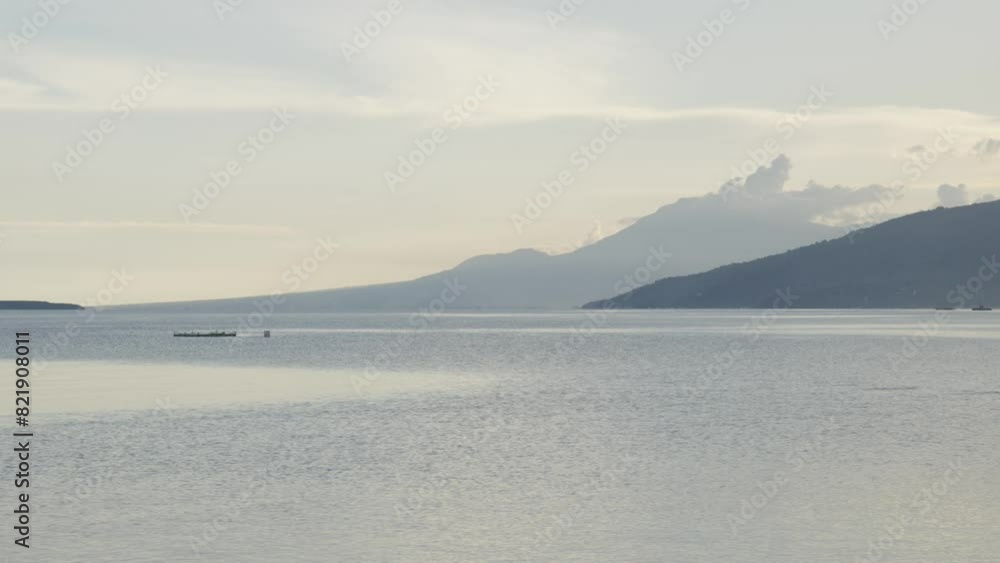 Scenic seascape and mountain view in Cebu, Philippines during cloudy evening. Scenic seascape and mountain view in Cebu, Philippines during cloudy evening.