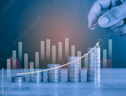 Upward Stack of money coin and man hand holding coin to stack with upward trending business and curve up arrow financial growth and success in the market. Business and financial background. 