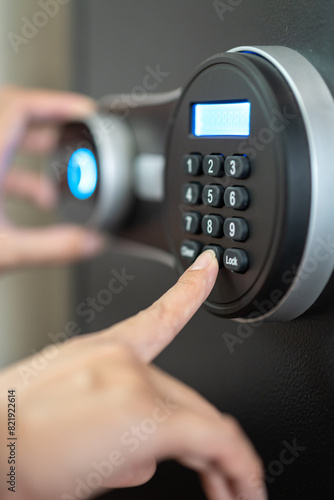 Canvastavla Action of people hand is unlocking to open the safe box door by pressing password on the number panel