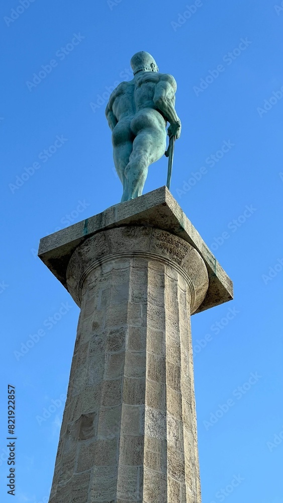 Vertical low angle shot of The Victor statue under a blue sky in Belgrade, Serbia Vertical low angle shot of The Victor statue under a blue sky in Belgrade, Serbia