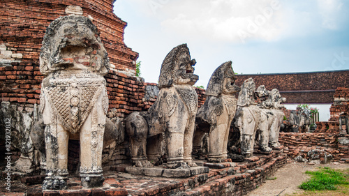 Ancient lion statues located around an old Ayutthaya period pagoda at Wat Thammikarat, Phra Nakhon Si Ayutthaya Province, Thailand.
 photo