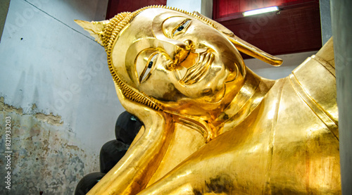 Reclining Buddha at Wat Thammikarat It is a twelve meter long bed built by King Trailokkanatha of the early Ayutthaya period.
 photo