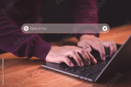 User use a computer laptop for internet search bar. SEO technology networking engine optimization internet with search bar. Searching browsing internet data information concept.