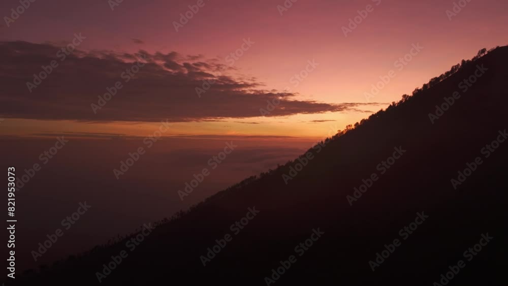 Aerial view of majestic Ijen volcano at sunrise with mist and sulfur gas, Kawah Ijen, Java, Indonesia. Aerial view of majestic Ijen volcano at sunrise with mist and sulfur gas, Kawah Ijen, Java, Indonesia.