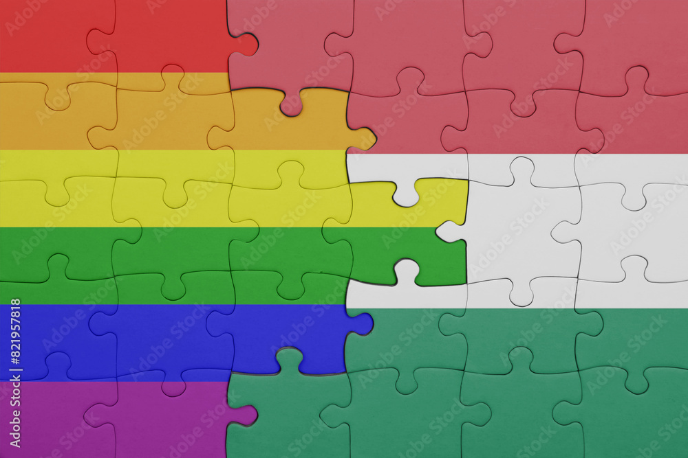 puzzle with the colourful national flag of hungary and rainbow gay pride flag . puzzle with the colourful national flag of hungary and rainbow gay pride flag .