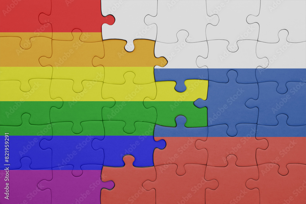 puzzle with the colourful national flag of russia and rainbow gay pride flag . puzzle with the colourful national flag of russia and rainbow gay pride flag .