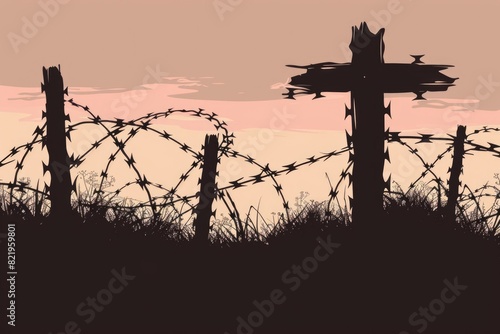 A religious cross placed on top of a barbed wire fence. Suitable for religious symbolism or persecution concepts photo