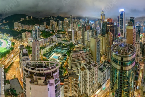 Photography Downtown Hong Kong city life with vibrant cityscape skyline glittering in the Wan Chai area at night