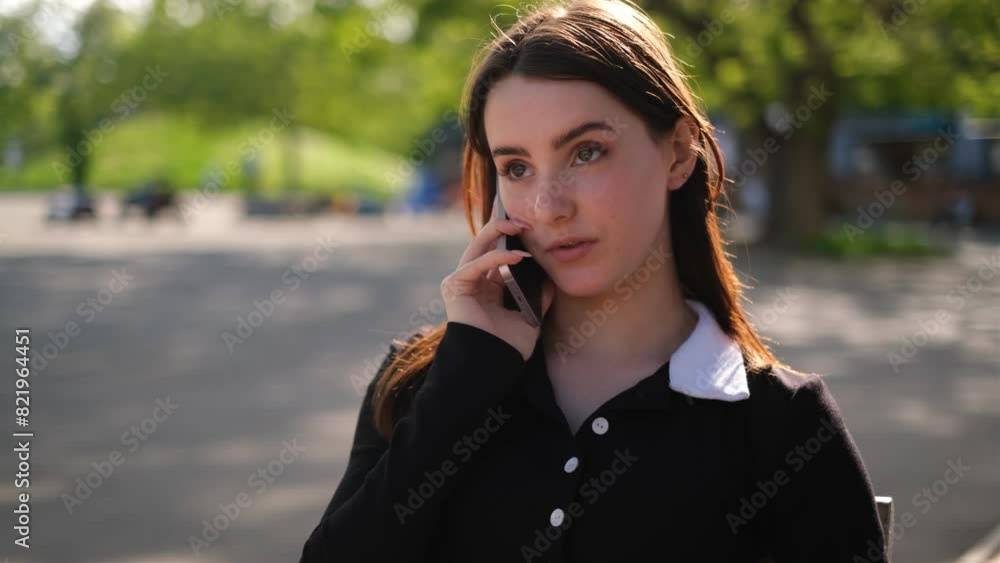 portrait of a young business lady talking on the phone on the street portrait of a young business lady talking on the phone on the street