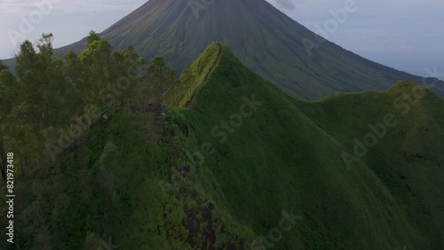 Aerial view of Mount Inerie volcano with lush jungle and serene summit view, Flores, Indonesia. photo