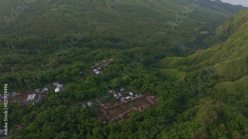 Aerial view of Mount Inerie with lush forest and Bena Traditional Village, Flores, Indonesia. photo