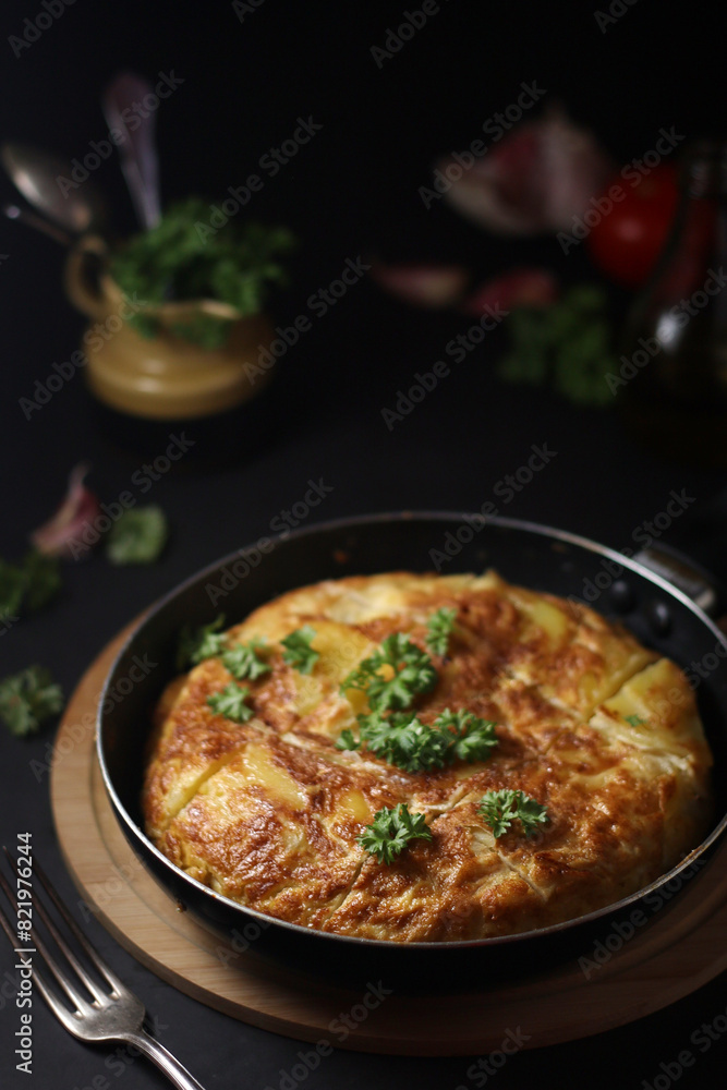 Traditional Spanish dish tortilla on the table Traditional Spanish dish tortilla on the table