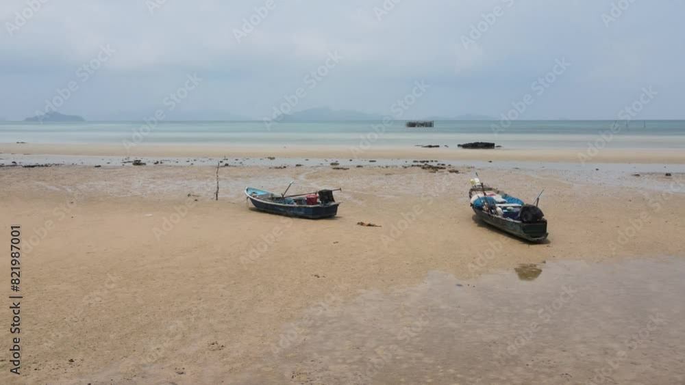 Aerial View Of Fishing Boats On Sandy Ao Tan Beach In Koh Mak. Circle Dolly Shot Aerial View Of Fishing Boats On Sandy Ao Tan Beach In Koh Mak. Circle Dolly Shot