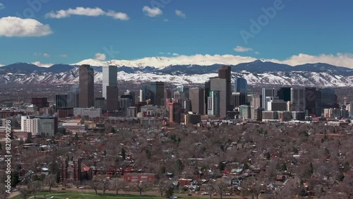 Fountain City Park Downtown Denver Colorado Spring Mount Blue Sky Evans Aerial drone USA Front Range Rocky Mountains foothills skyscrapers neighborhood Ferril Lake daytime sunny clouds circle left photo