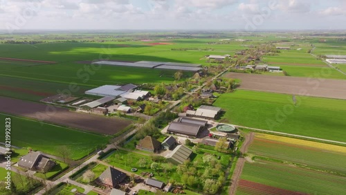 Aerial view of greenhouses, cows, and farmland in rural village, Obdam, North Holland, Netherlands. photo