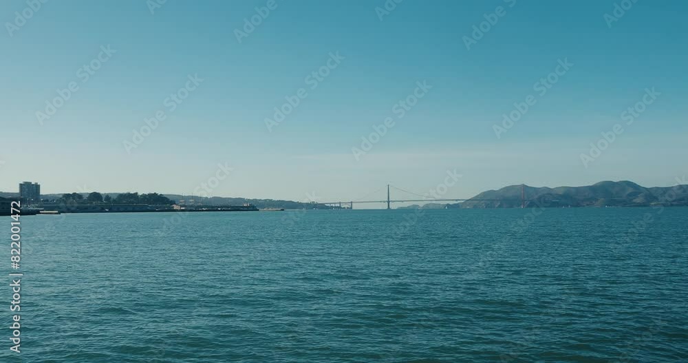 View of the Golden Gate strait, with the Golden Gate Bridge in distance in San Francisco, California View of the Golden Gate strait, with the Golden Gate Bridge in distance in San Francisco, California