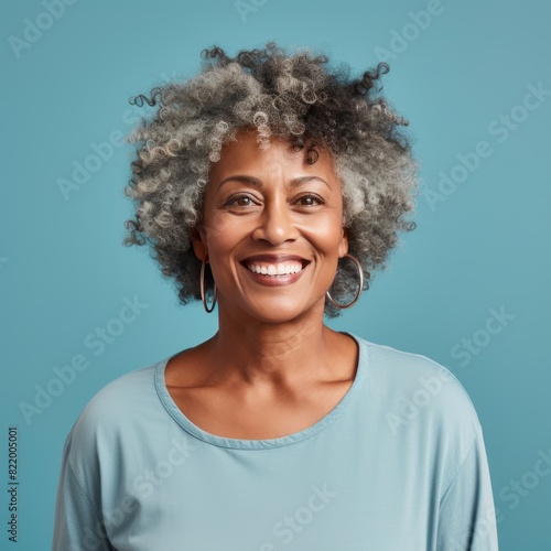 Aqua Background Happy black american independant powerful Woman. Portrait of older mid aged person beautiful Smiling girl Isolated on Background ethnic 