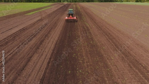 Aerial view of cultivated field with tractor and soil, Bourtange, Netherlands. photo