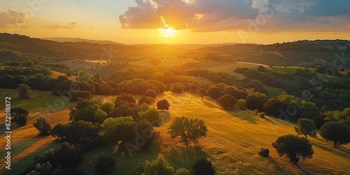 Aerial view of Alcarria lush fields and woodlands bathed in the warm glow of a sunset sky photo