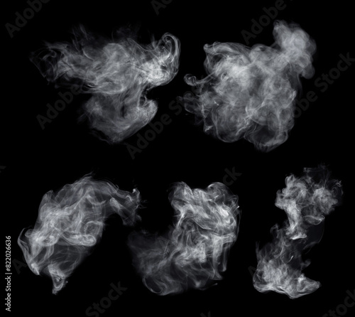 Fog or smoke set isolated on black background. White cloudiness, mist or smog background. Collection of varied white smoke on a black background.