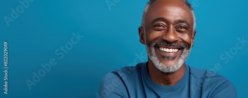 Blue Background Happy black american independant powerful man. Portrait of older mid aged person beautiful Smiling boy Isolated on Background ethnic diversity
