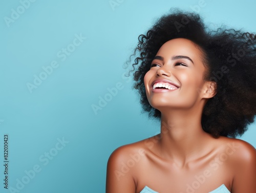 Blue background Happy black independant powerful Woman realistic person portrait of young beautiful Smiling girl Isolated on Background ethnic diversity equality acceptance concept with copyspace blan