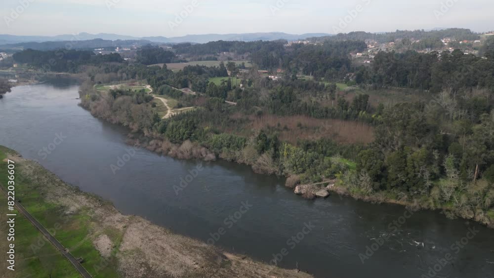 Aerial view of Minho River, forest, hills, and valley, Salvaterra de Mino, Pontevedra, Spain. Aerial view of Minho River, forest, hills, and valley, Salvaterra de Mino, Pontevedra, Spain.