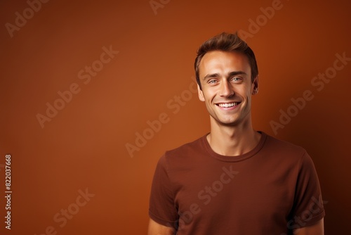 Brown background Happy european white man realistic person portrait of young beautiful Smiling man good mood Isolated on Background Banner with copyspace 