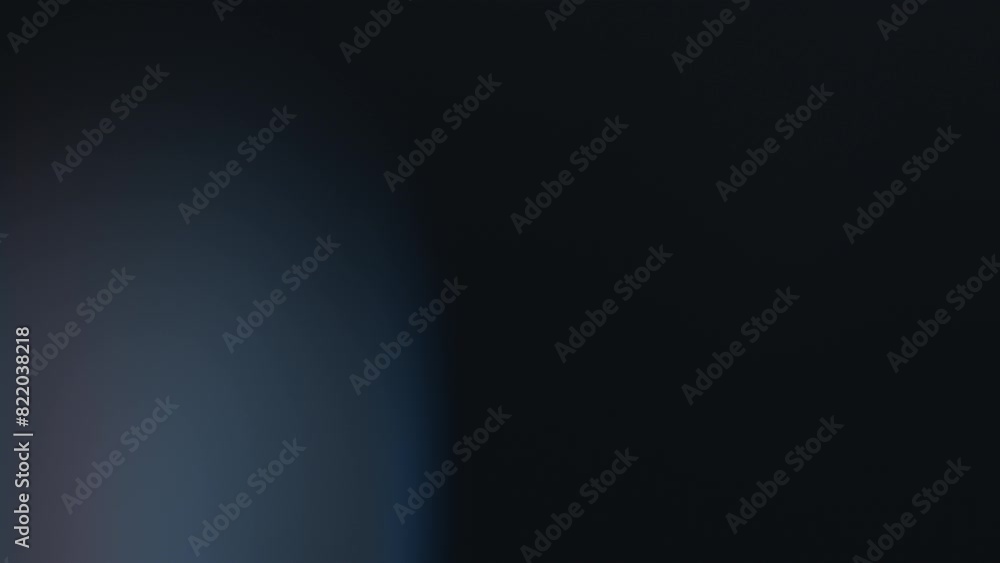 Dark blue bokeh lights form an abstract pattern Against a black backdrop, seemingly in motion Dark blue bokeh lights form an abstract pattern Against a black backdrop, seemingly in motion