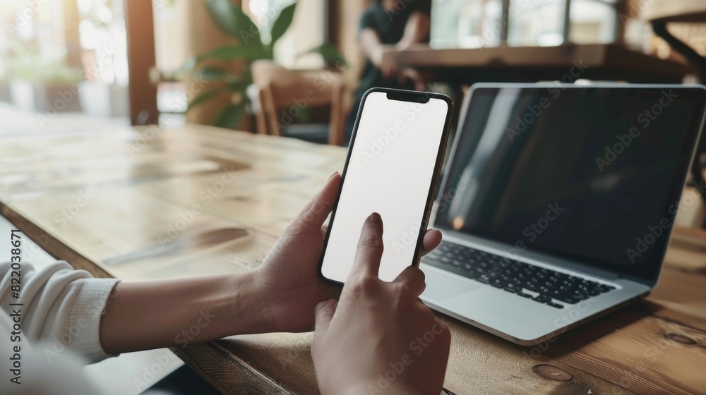 Woman's hand holding a blank white screen. Woman's hand holding a blank white screen.