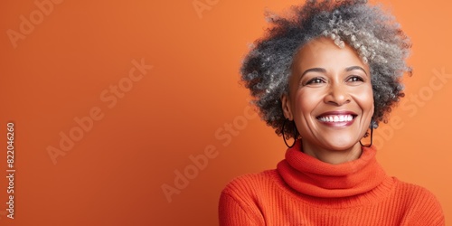 Coral Background Happy black american independant powerful Woman. Portrait of older mid aged person beautiful Smiling girl Isolated on Background ethnic 
