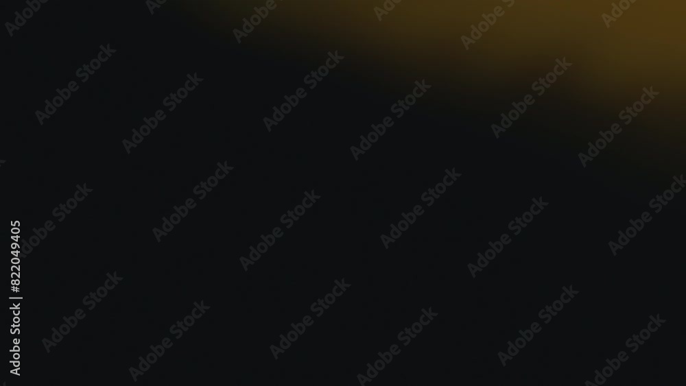 Abstract effect of the blurry yellow lights smoothly moving on a black background Abstract effect of the blurry yellow lights smoothly moving on a black background