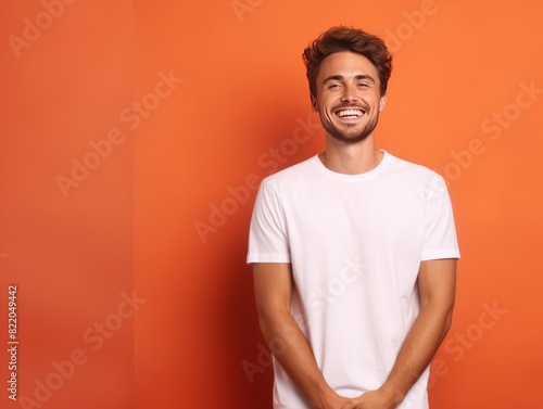 Coral background Happy european white man realistic person portrait of young beautiful Smiling man good mood Isolated on Background Banner with copyspace blank © Zickert