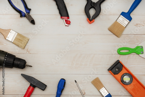 A set of tools for repair work in a house or apartment. Tools for a builder or electrician. Flat layout. There is space for text