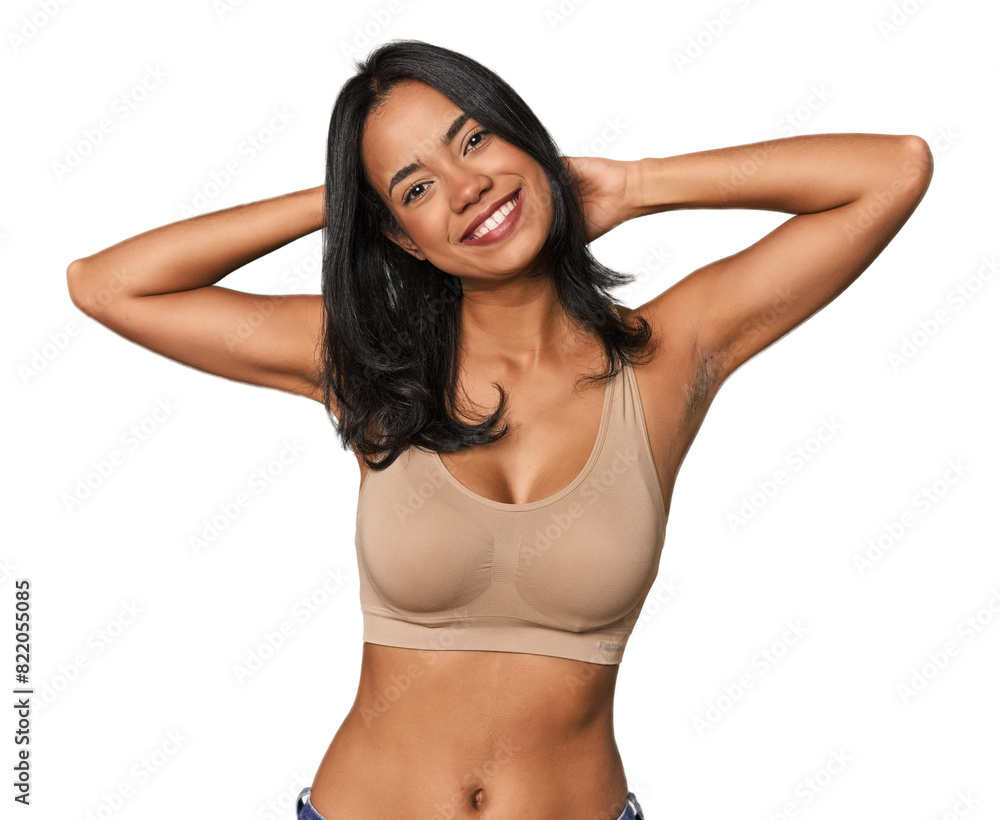 Fototapeta premium Young Filipino woman in light wear stretching arms, relaxed position.
