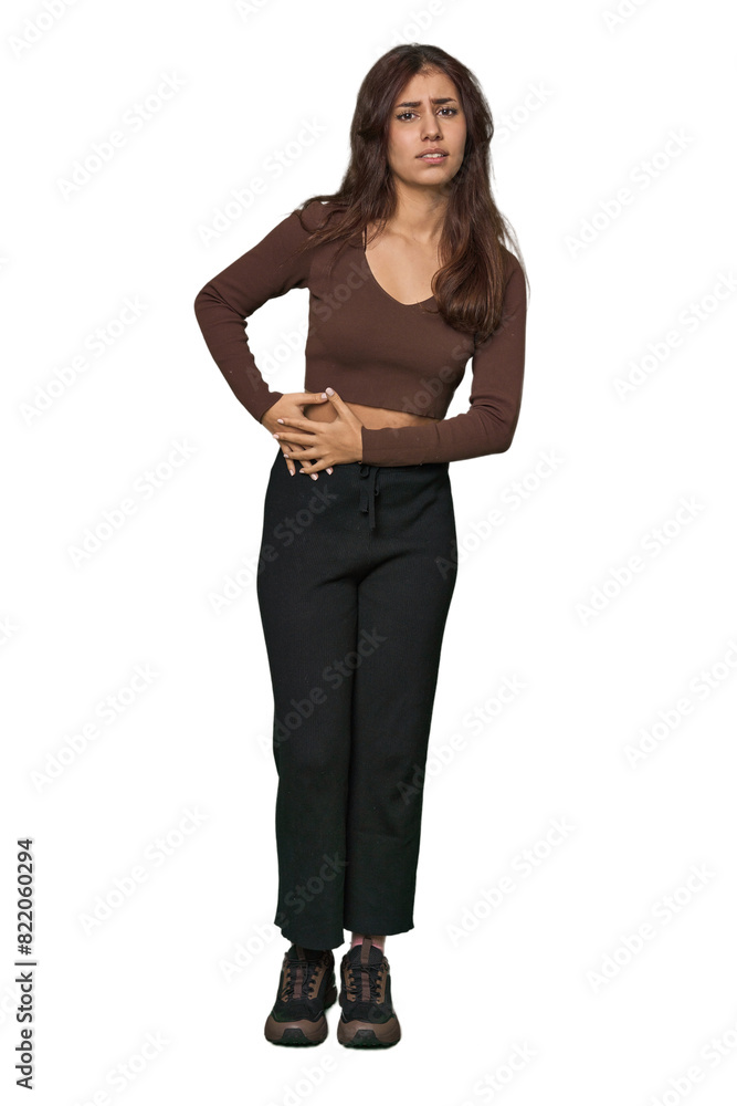 Middle Eastern woman, full body studio having a liver pain, stomach ache. Middle Eastern woman, full body studio having a liver pain, stomach ache.