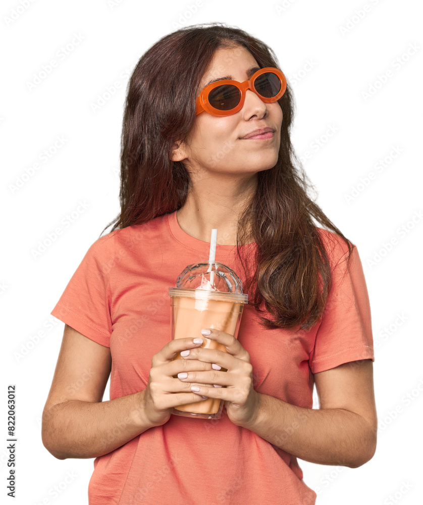 Young Middle Eastern woman with sunglasses, vanilla shake Young Middle Eastern woman with sunglasses, vanilla shake