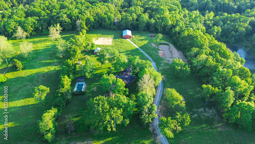 Tableau sur toile Farm houses on large acreage rural lots lush greenery trees, large storage shed