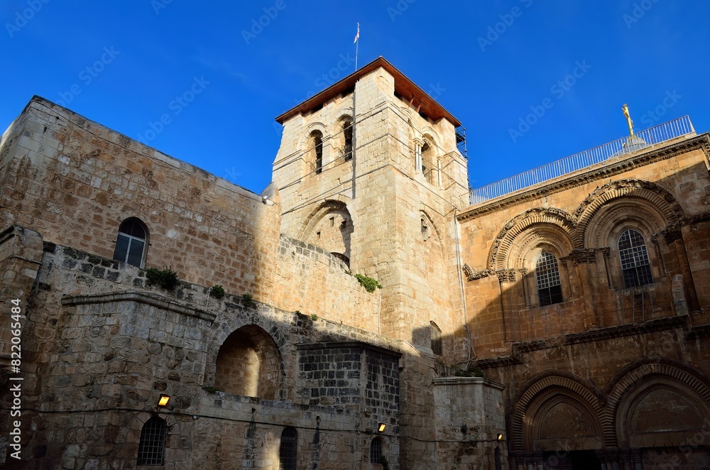 Historic Church of the Holy Sepulchre in Jerusalem under clear blue sky Historic Church of the Holy Sepulchre in Jerusalem under clear blue sky