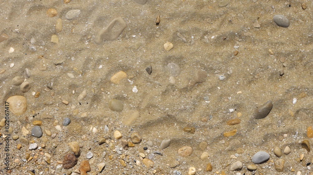 Closeup of Sand and Pebbles on Beach Closeup of Sand and Pebbles on Beach