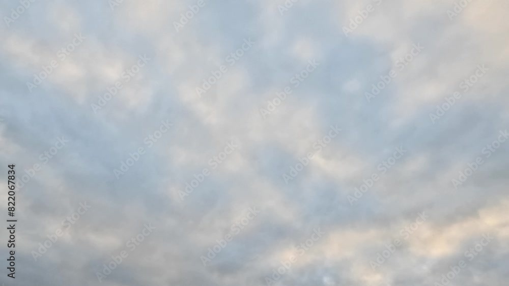 Timelapse of white clouds moving in blue sunny sky at the daytime Timelapse of white clouds moving in blue sunny sky at the daytime