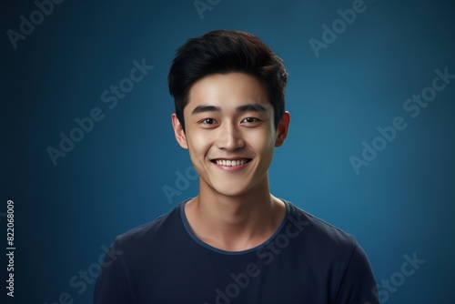 Indigo Background Happy asian man realistic person portrait of young teenage beautiful Smiling boy good mood Isolated on Background ethnic diversity equality acceptance